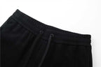 Black jogger pants waistband with drawstring and elastic seam