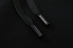 Inside waistband label on black Burberry track pants