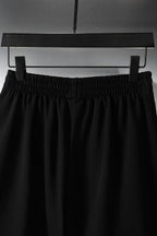 Balenciaga pants in black with elastic waistband and pleated front