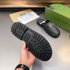 Gucci mule sandal sole view with tread and GG-pattern upper, gold-tone horsebit detail
