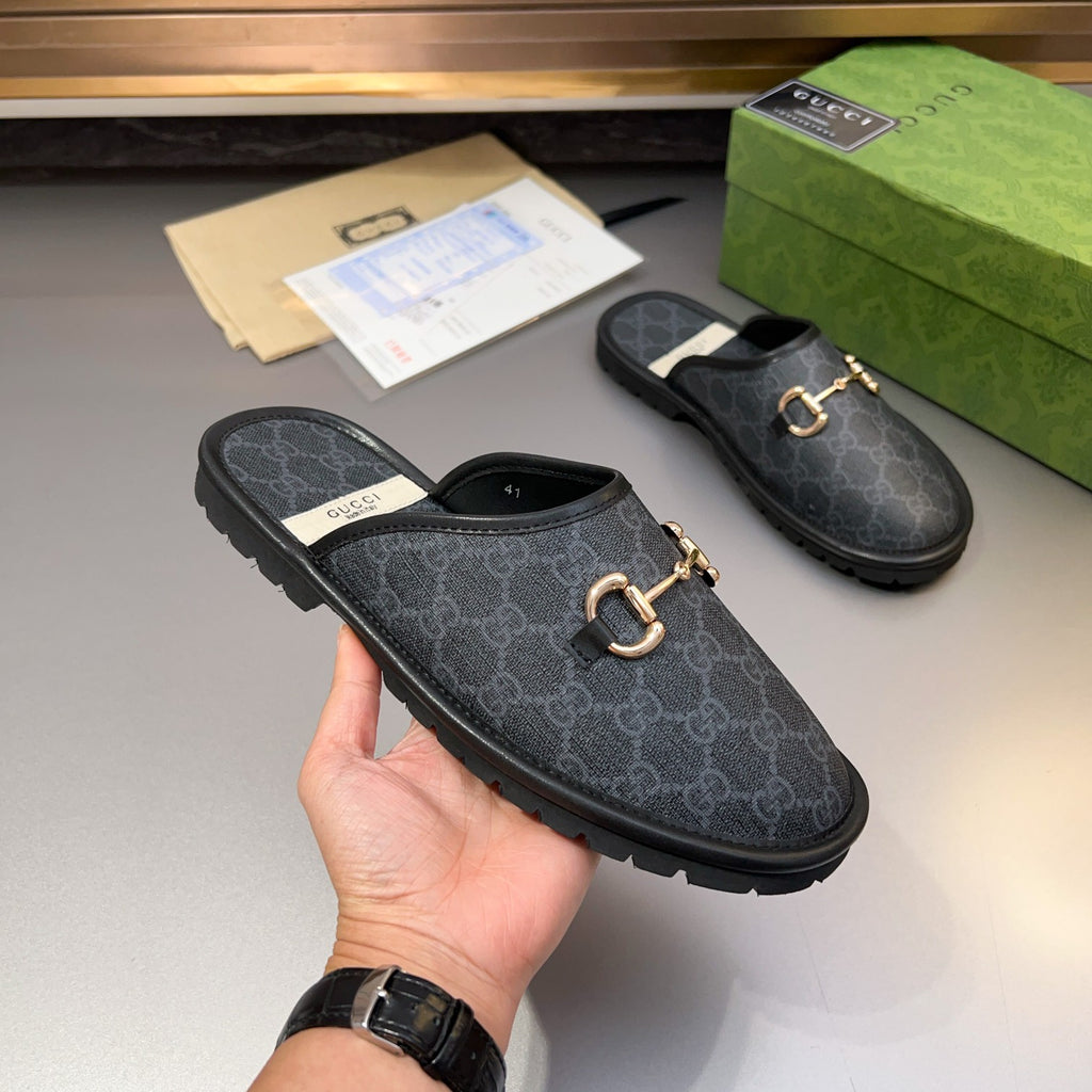 Gucci GG patterned slide sandal with gold-tone horsebit buckle, dark upper and rubber sole