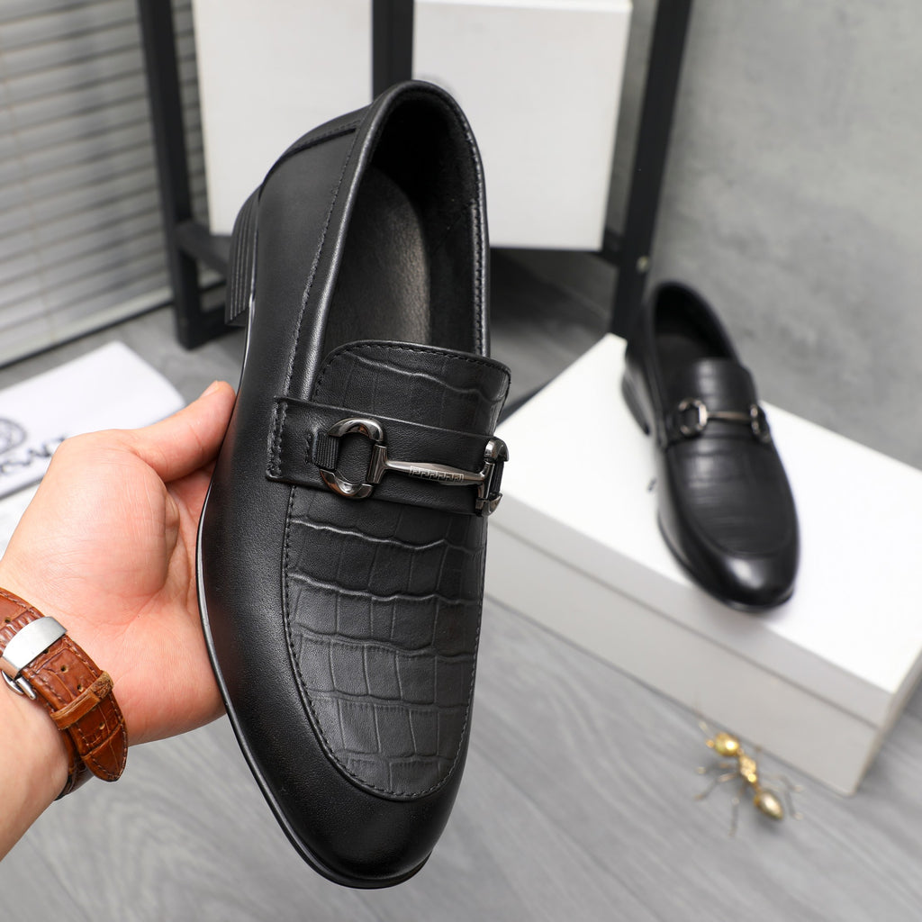 Black leather loafer with metal buckle strap and croc-embossed vamp