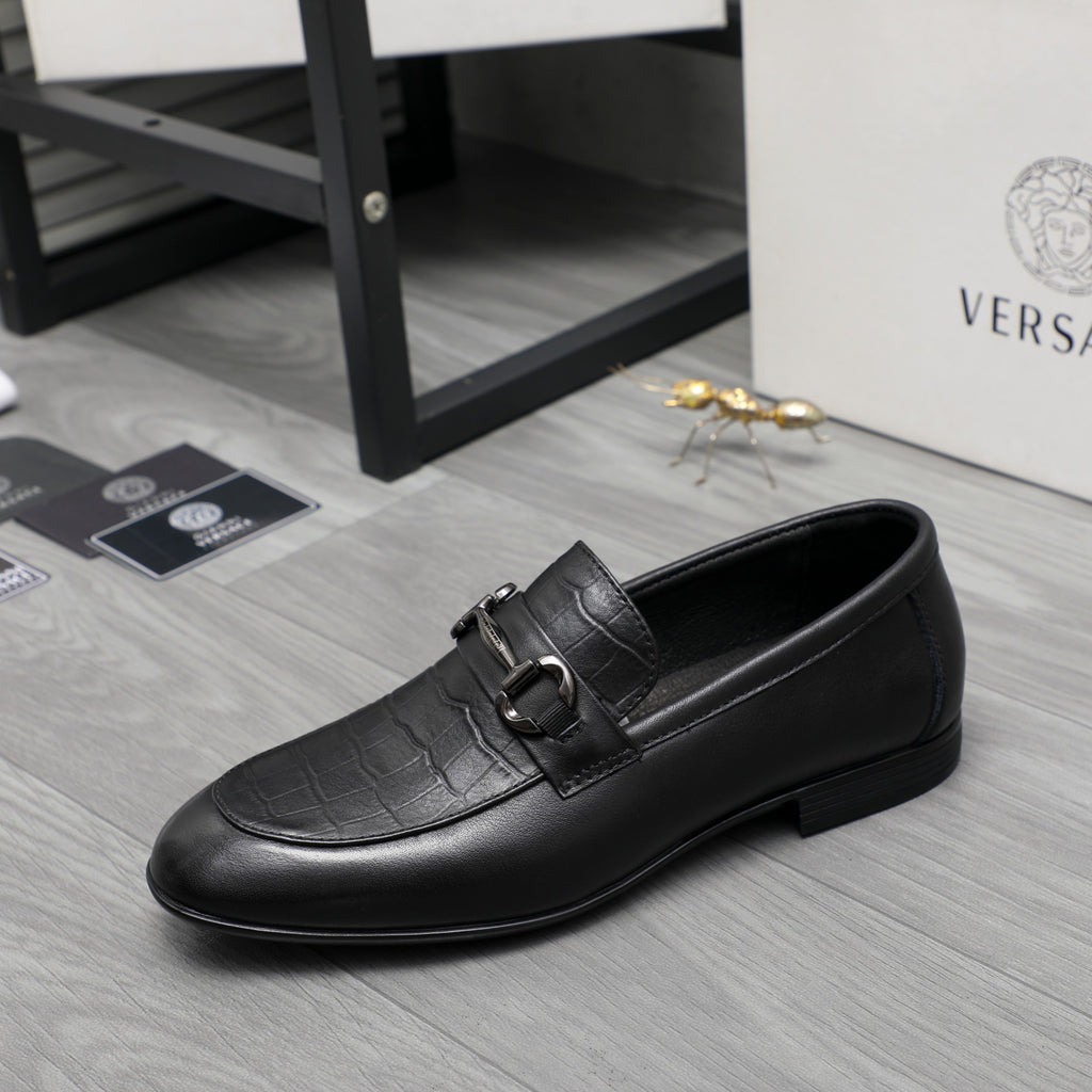 Black leather loafer with side strap buckle and smooth moc toe