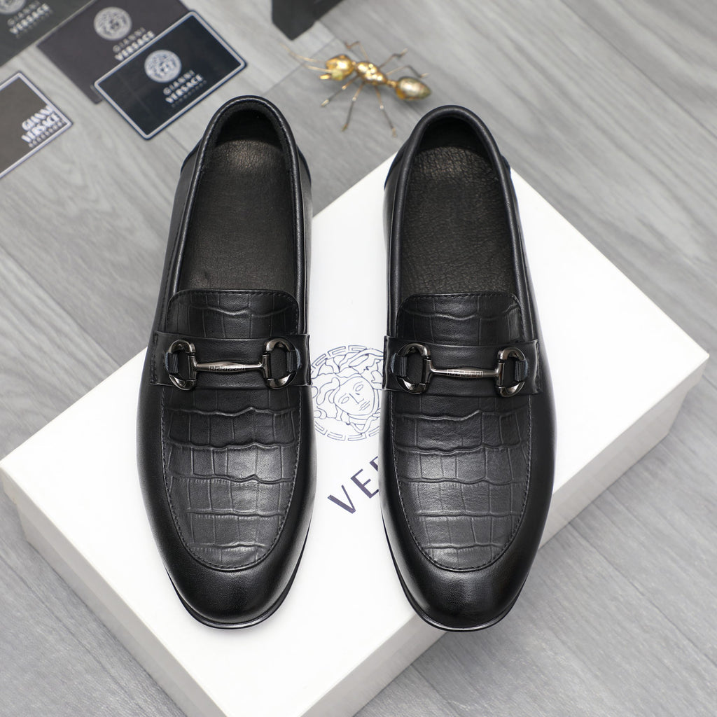Leather loafer with black crocodile-embossed toe and strap buckle
