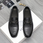 Leather loafer with black crocodile-embossed toe and strap buckle