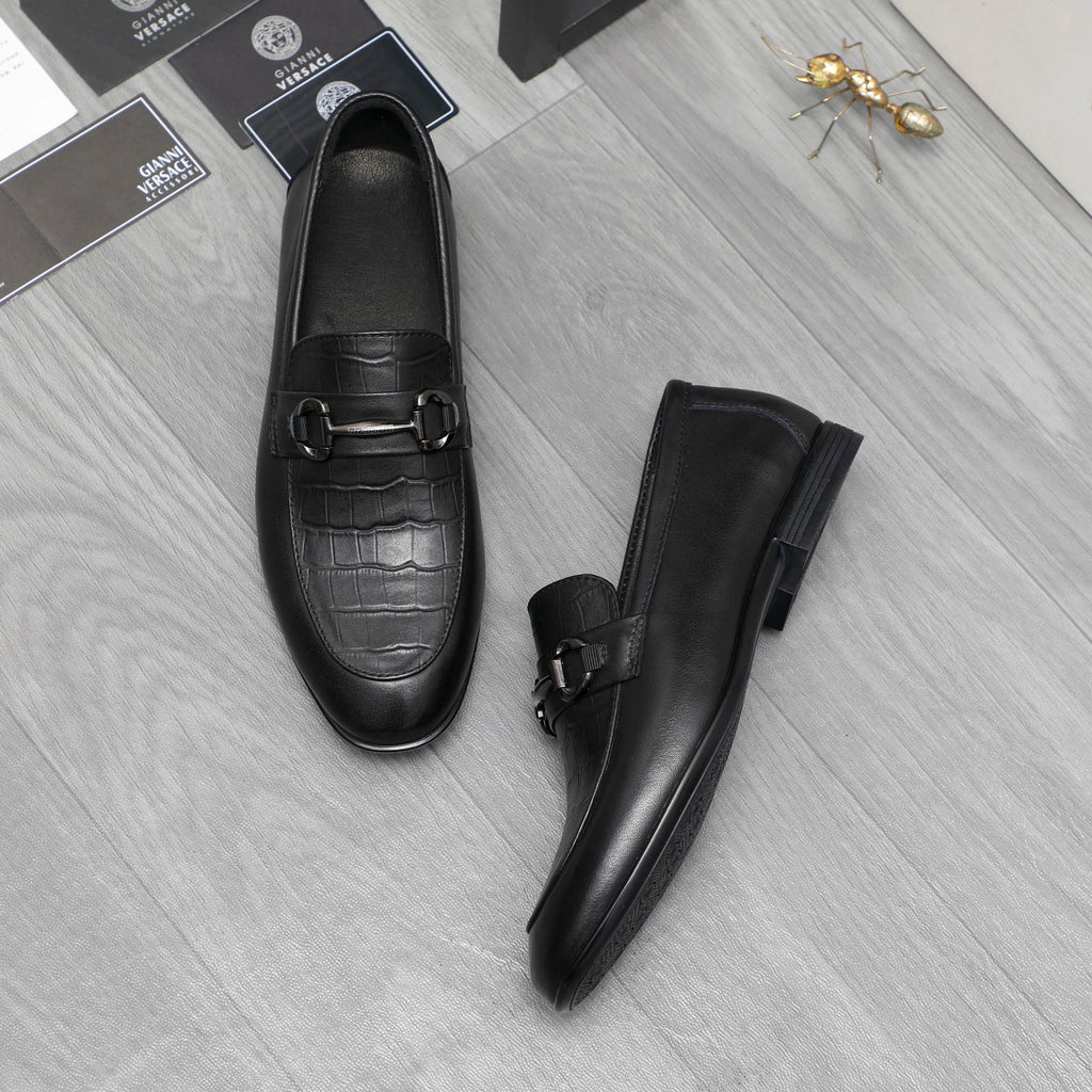 Leather loafer set in black with metal strap buckle and low block sole