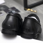 Leather loafer heel view in black with smooth back and ridged sole