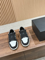 Amiri low-top sneakers, black glitter, white panels, black laces, rubber sole