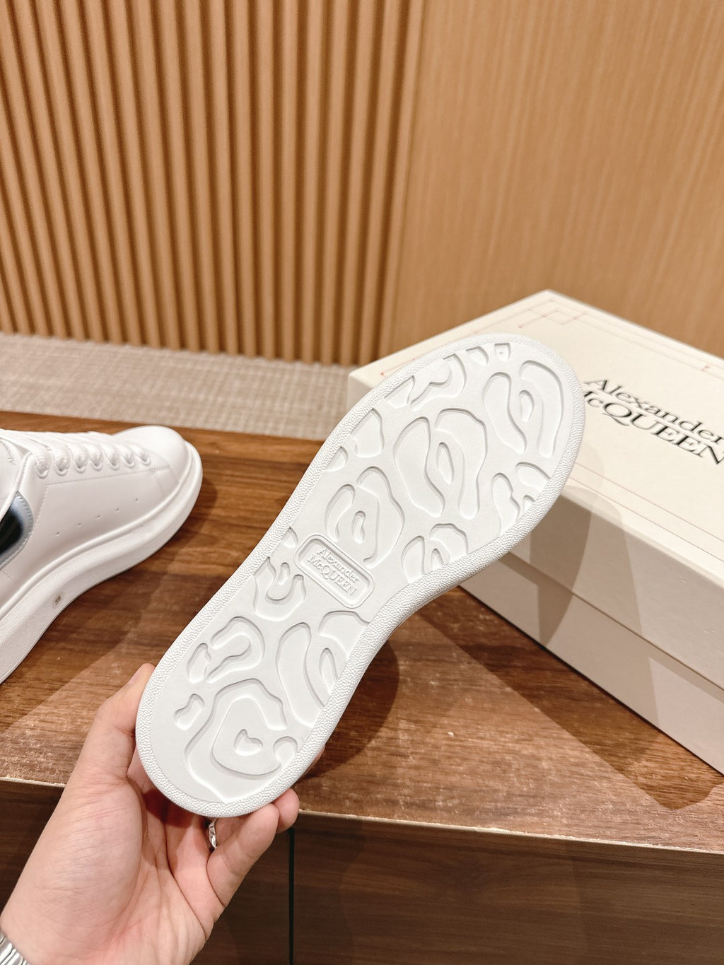 White Alexander McQueen sneaker outsole with grippy tread pattern
