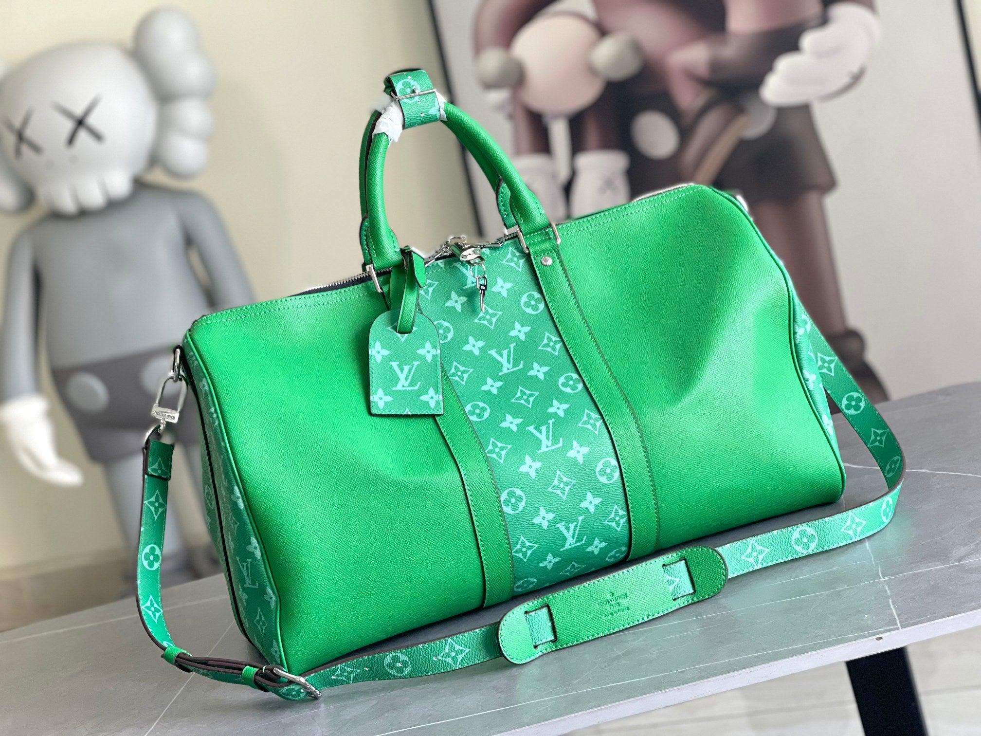 Louis Vuitton men’s green duffel bag with monogram pattern, top handles, shoulder strap