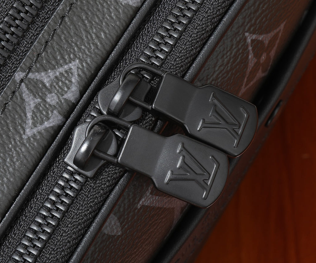 Louis Vuitton zipper pull and hardware on monogram crossbody bag, dark finish