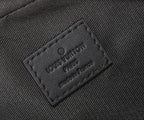 Louis Vuitton branded leather tag on monogram crossbody bag, embossed logo, dark gray