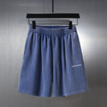 Balenciaga blue shorts with elastic waistband and small logo on front leg