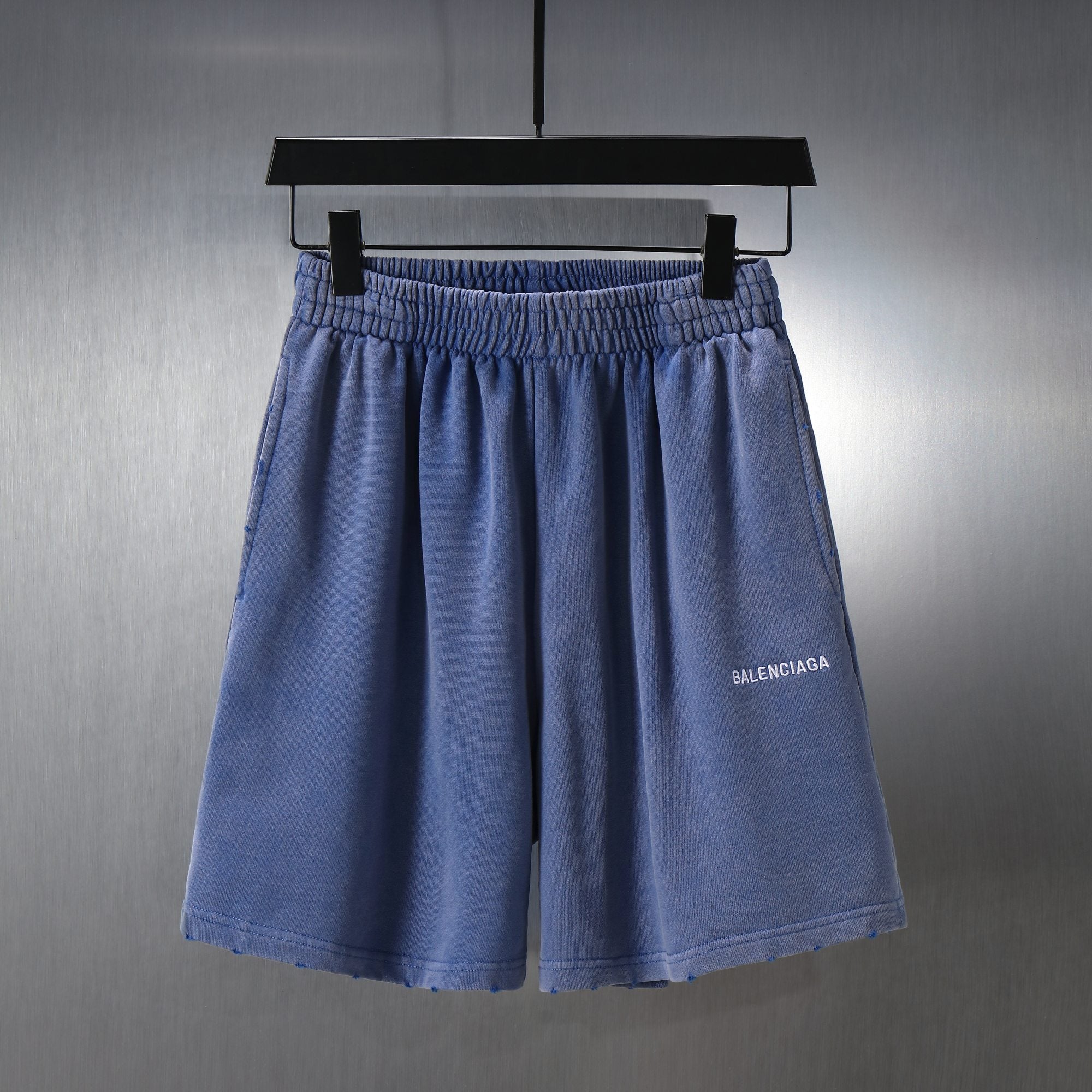 Balenciaga blue shorts with elastic waistband and small logo on front leg
