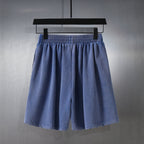 Balenciaga blue shorts on hanger with gathered elastic waistband and pleated front