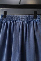 Balenciaga blue shorts close-up of elastic waistband and draped front panels