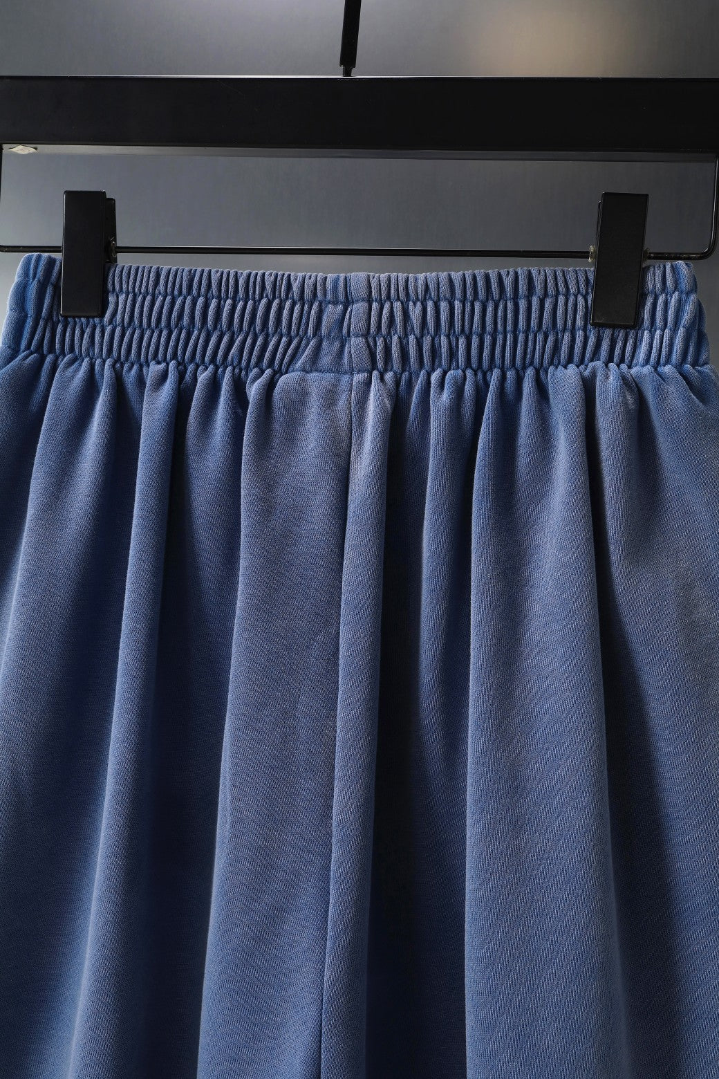 Balenciaga blue shorts close-up of elastic waistband and draped front panels
