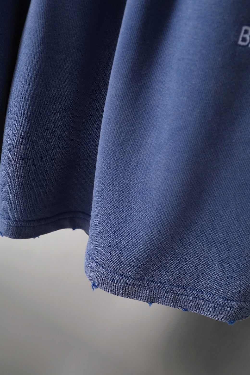Balenciaga blue shorts hem and side seam with curved bottom edge