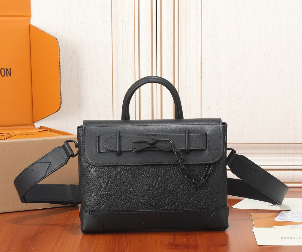 Louis Vuitton leather bag with top handle, front flap, and adjustable shoulder strap