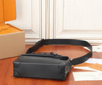 Louis Vuitton men's bag from side angle with crossbody strap and top handle loop.