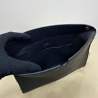 Hermes bag interior view with dark lining and side opening edge in dark blue leather.