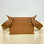 Hermes leather shoulder bag with top handles and logo front detail, tan