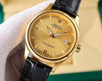 Rolex Datejust wristwatch with gold-tone case, champagne dial, and black leather strap