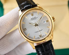 Rolex Datejust wristwatch with gold-tone case, silver dial, and black leather strap