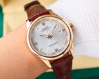 Rolex watch with white dial, rose-gold tone case, brown leather strap