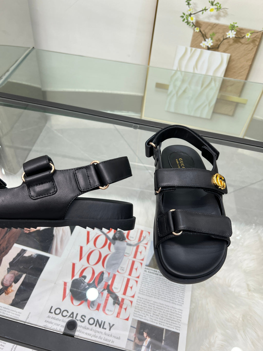 Gucci black sandals with adjustable strap and gold-tone buckle accents