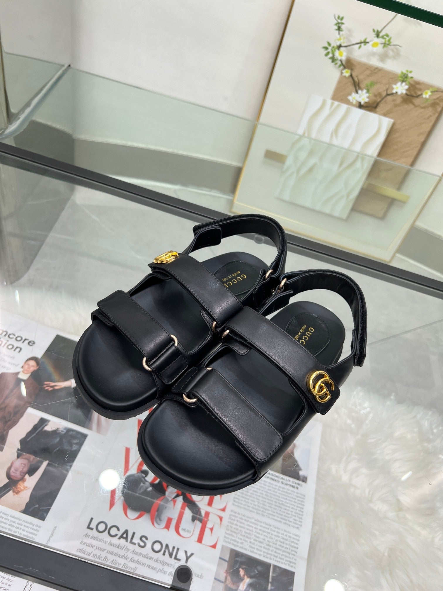 Gucci black platform sandals with double buckled straps and gold logo hardware