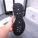 Versace sneaker outsole view with raised rubber nubs and traction tread pattern