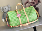 Louis Vuitton green checkered satchel bag with tan handles and zipper closure