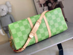 Louis Vuitton green checkered bag with tan shoulder strap and long front zipper
