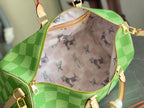 Louis Vuitton green checkered bag interior with light patterned lining and zipper