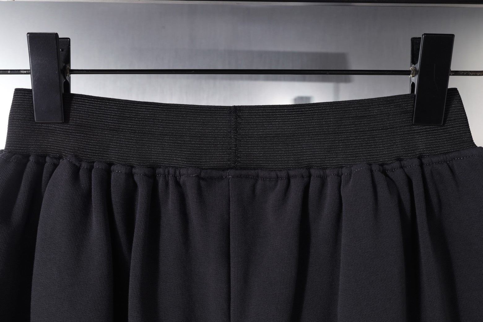 Balenciaga elastic waistband and pleats on dark shorts
