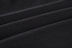 Balenciaga waistband fabric and fold detail on dark shorts
