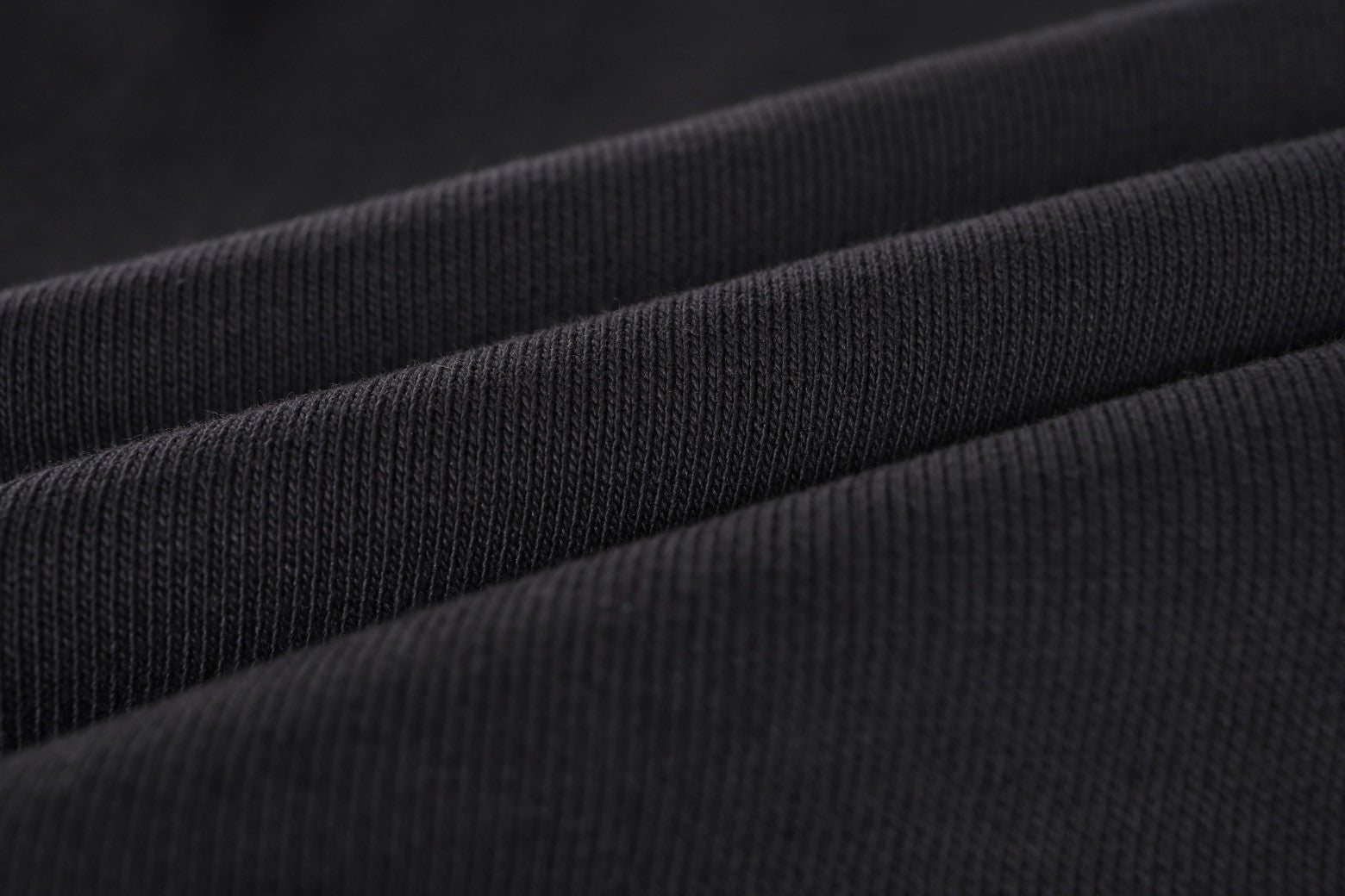 Balenciaga waistband fabric and fold detail on dark shorts
