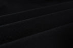 Black woven fabric close-up with subtle fine texture