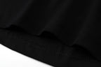 Black hem with fine stitching and gathered fabric edge