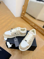 Amiri lace-up sneakers with white leather and gold glitter details, white laces