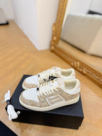 Amiri low-top sneakers with white leather and gold glitter side panel, white laces