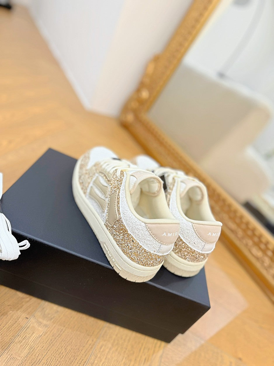 Amiri lace-up sneakers with white interior lining and gold glitter side panels
