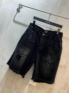 Balenciaga denim jeans shorts, dark blue, front pockets, frayed cuffs, hanger view