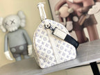 Monogram duffel bag side view with top handle and adjustable strap, blue pattern on white