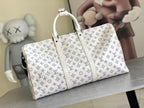 Monogram duffel bag with white top handles, blue repeat logo pattern, and front zipper seam