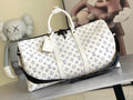 Louis Vuitton monogram duffel bag with white handles and blue logo pattern