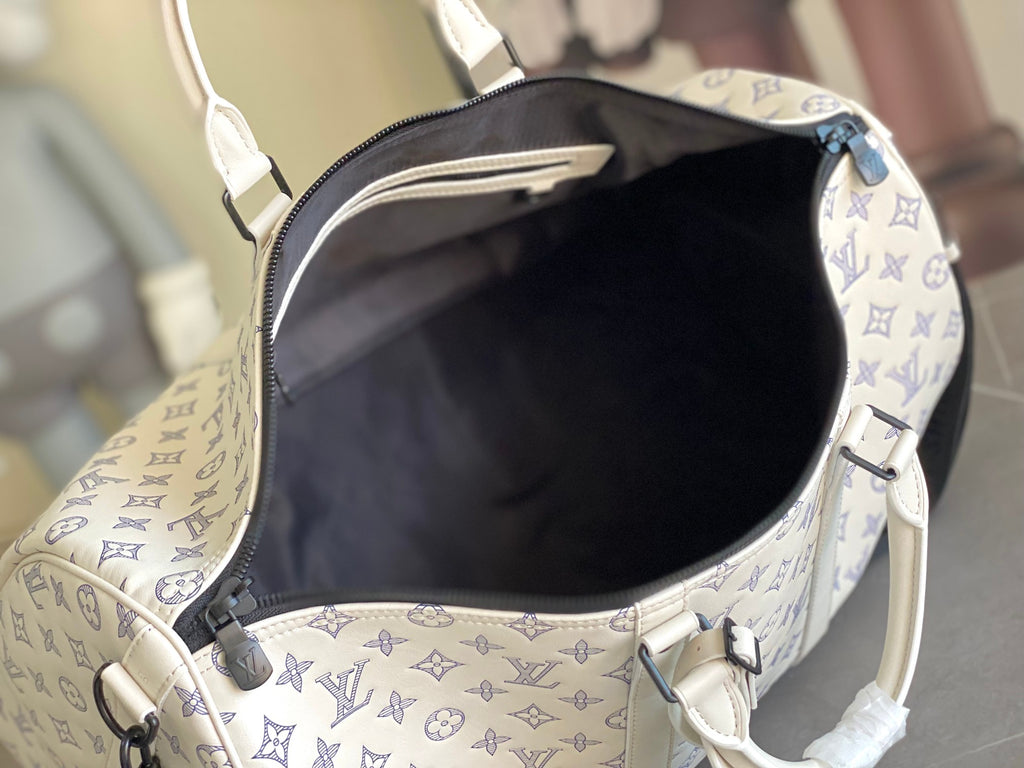 Louis Vuitton monogram duffel bag interior with dark lining and zipper edge