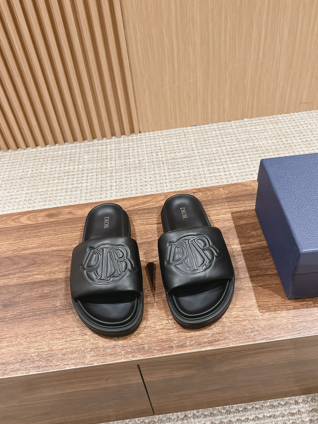 Black Dior unisex slide sandals with embossed logo on straps