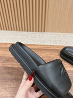 Black Dior unisex slide sandal with thick rubber sole and textured strap